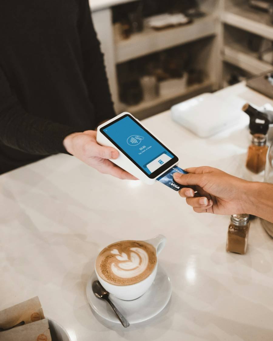 Customer paying by card at a counter