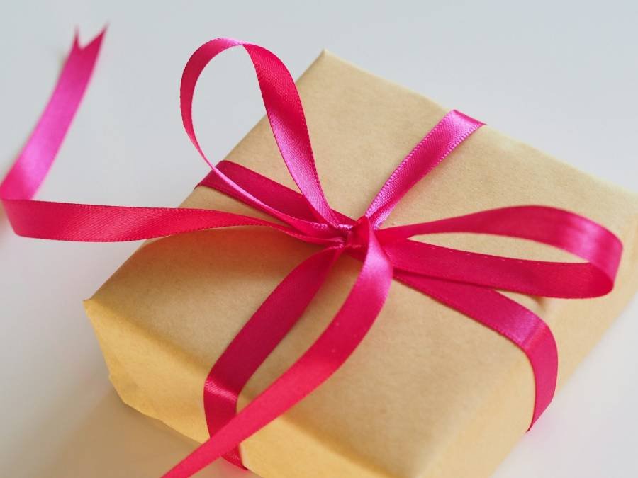 Gift box tied with a pink ribbon