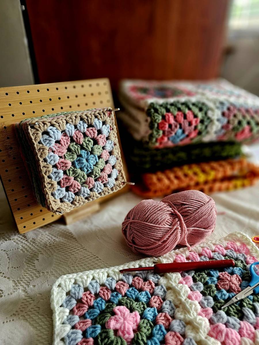 Crocheted squares and folded crochet blankets